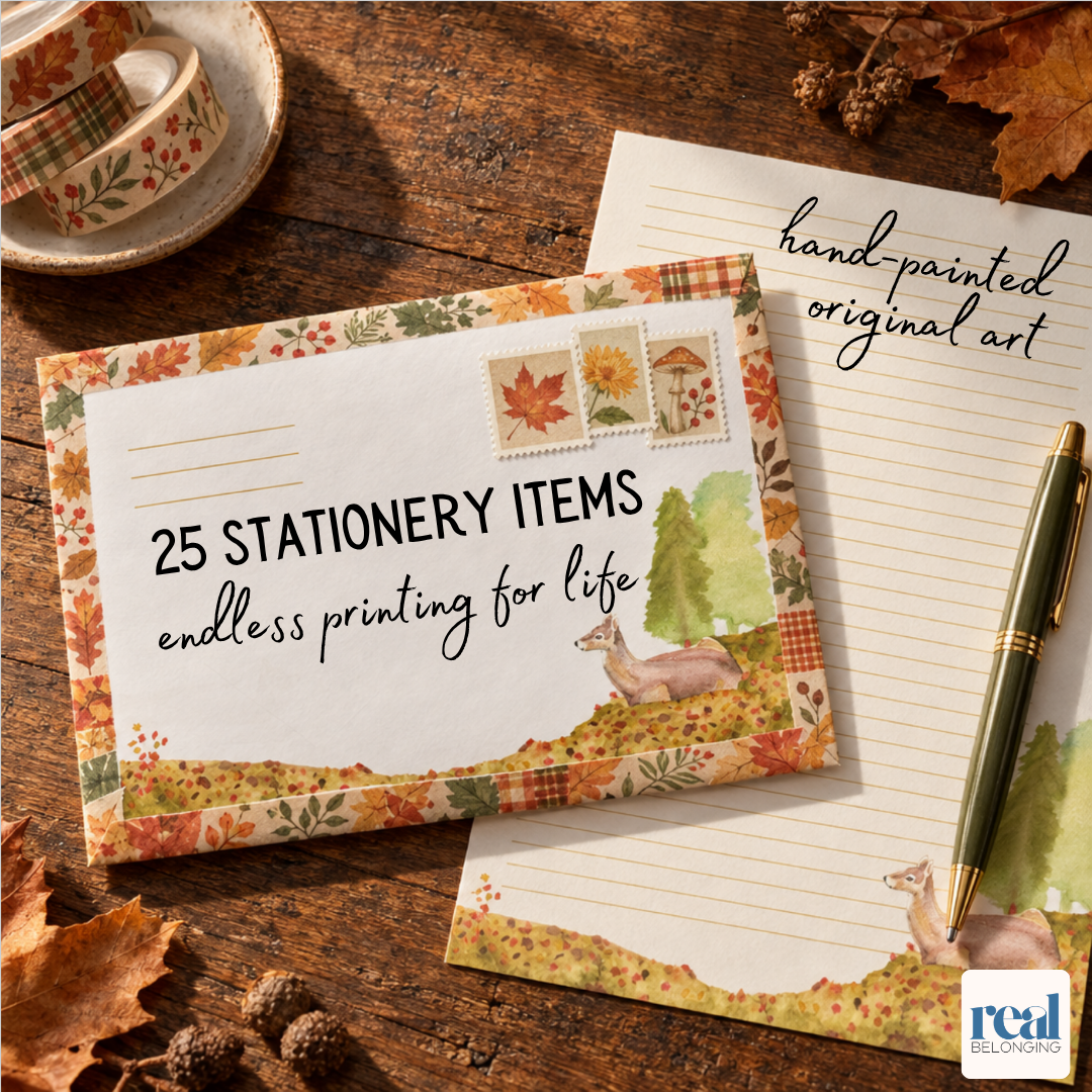 White watercolor envelope decorated with postage stamps and washi tape beside lined letter paper