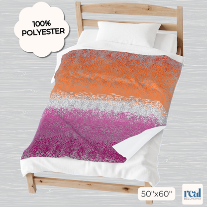 Colorful bedding set with gradient pattern on a wooden bed frame, featuring '100% Polyester' label.