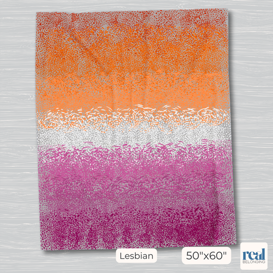 50"x60" gray blanket with lesbian pride flag printed in hand-drawn spots indicating motion and stillness across the canvas. 7 colors from dark blood orange up top, orange, light orange, white, pink, dusty rose pink, and dark pink at the bottom.