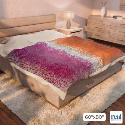 60"x80" gray blanket with Lesbian colored Organic Pride design print in swirling dots across the entire blanket. Blanket is laying across a King size bed for perspective in a neutral tan room.